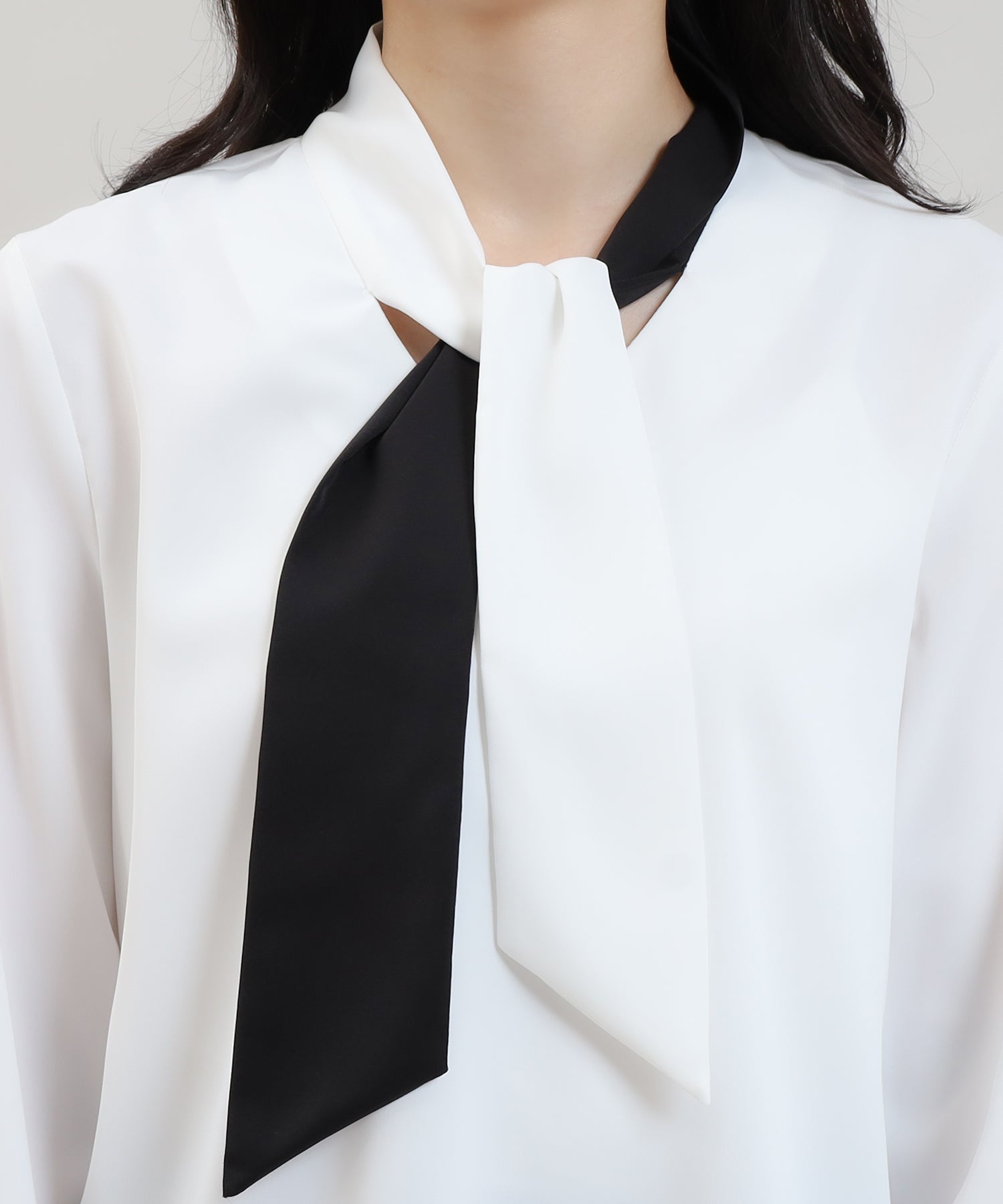 Asymmetrical color scheme bow tie blouse